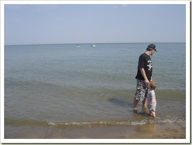 Vincent and Dad walking in Lake Huron