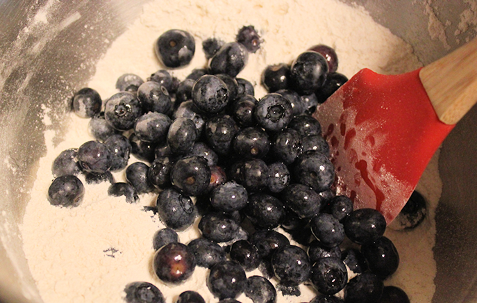 Combine blueberries very carefully with dry ingredients